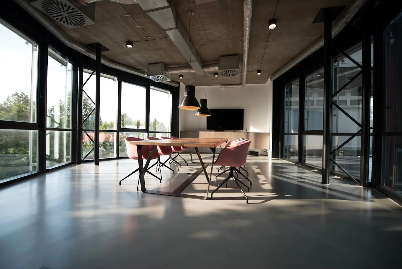 Calm architectural interior with restrained material palette and filtered daylight.